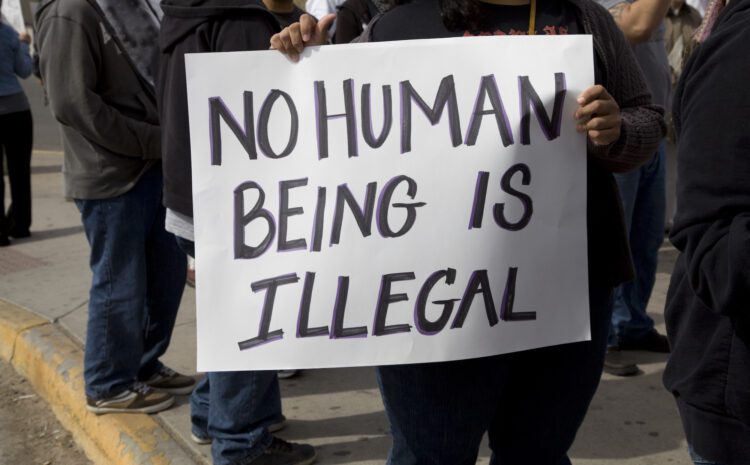 Protest sign from an Immigration Policy rally. Sign reads "No Human Being is Illegal"