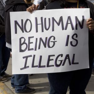 Protest sign from an Immigration Policy rally. Sign reads "No Human Being is Illegal"